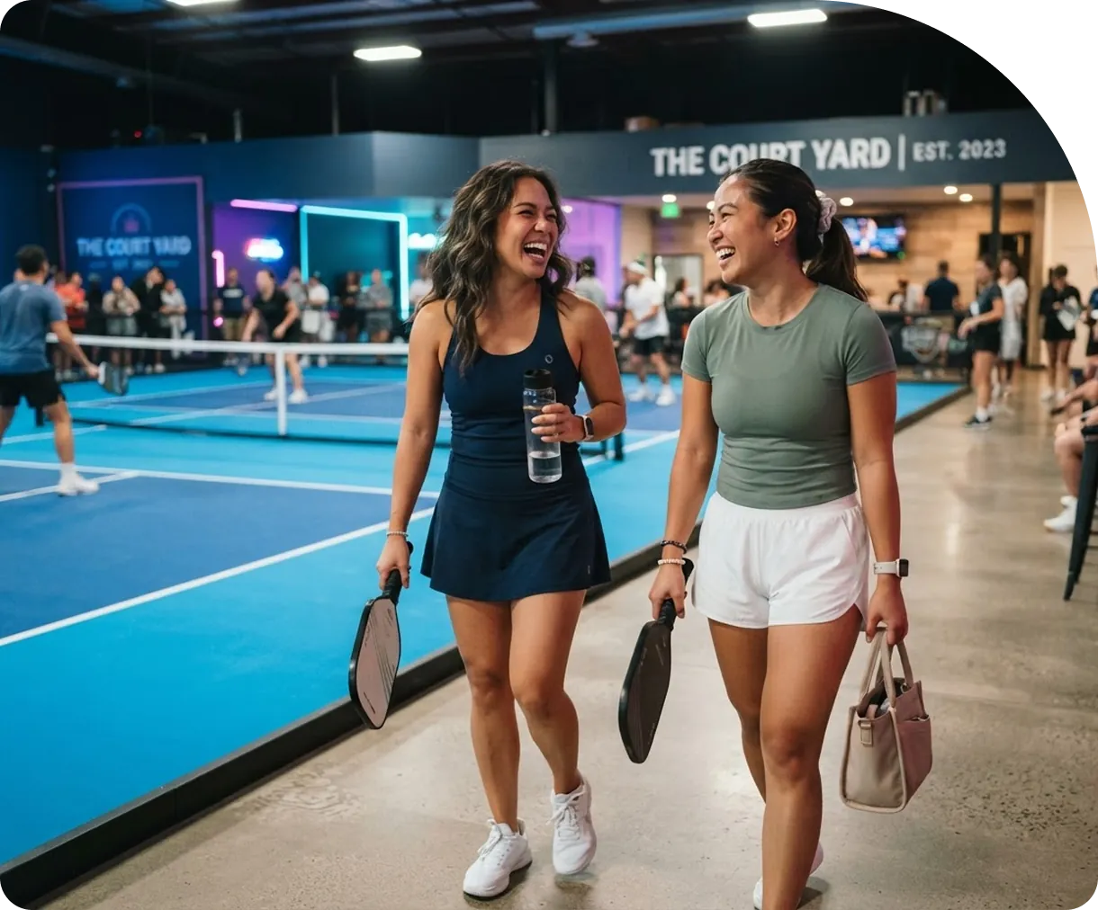 A player checking a booking on their phone at the court